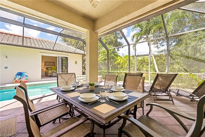 Covered Outdoor Dining Overlooking the Pool