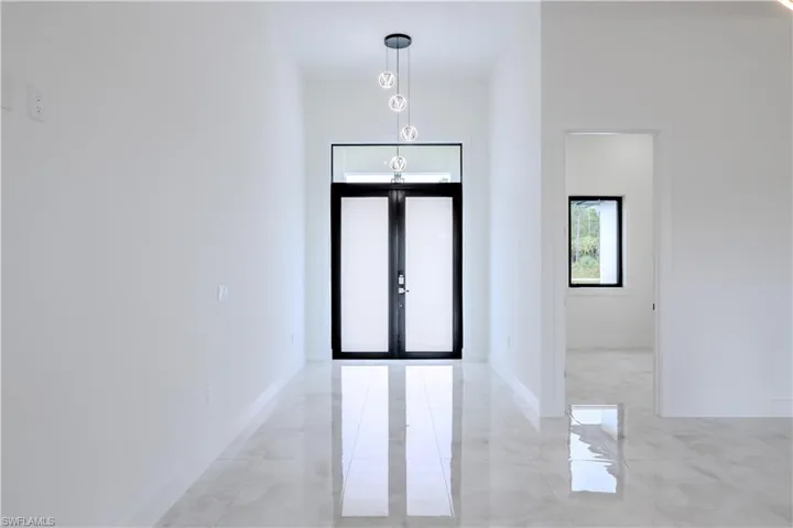 View of patio featuring ceiling fan