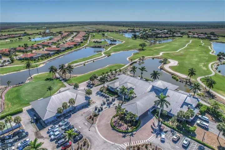 Bird's eye view featuring a water view and view of golf course