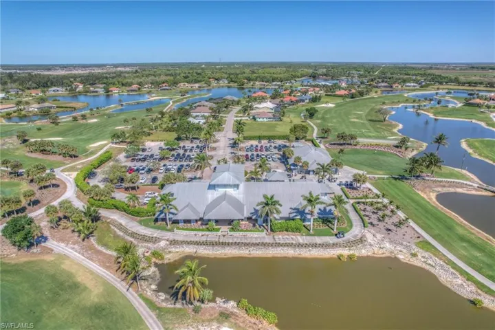 Bird's eye view featuring golf course view and a water view