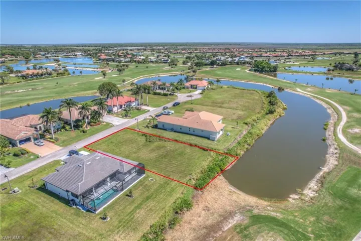 Birds eye view of property featuring golf course view and a water view