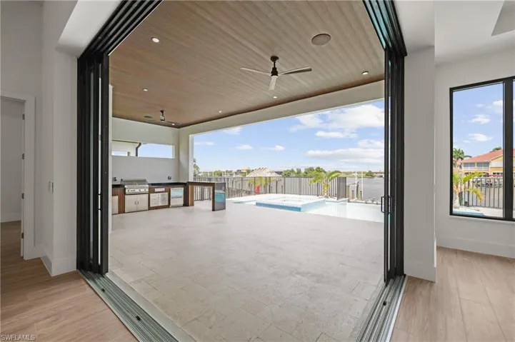 View of patio / terrace featuring exterior kitchen and a ceiling fan