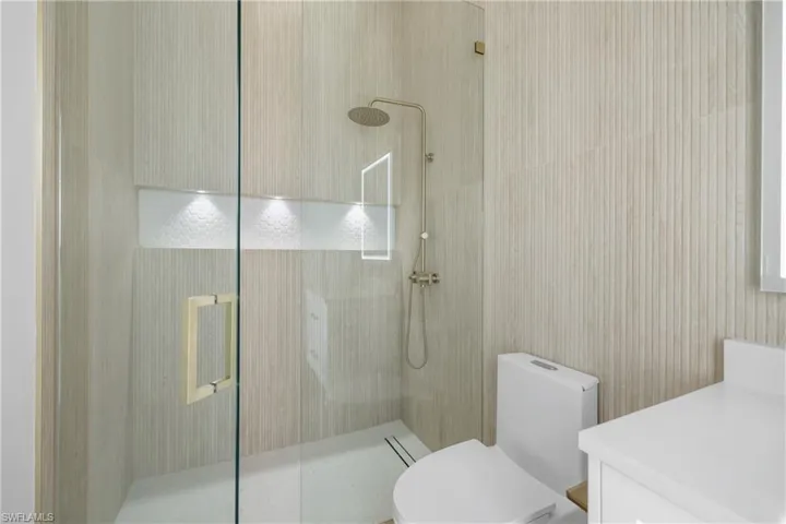 Full bathroom with walk in shower and vanity