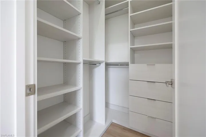 Spacious closet featuring light wood finished floors