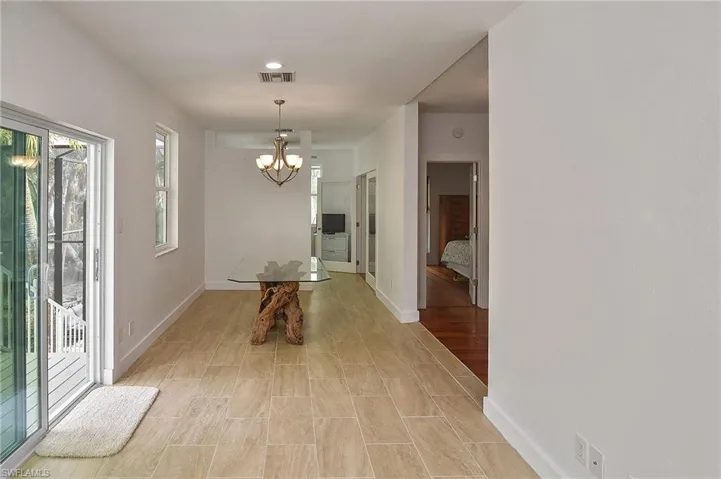 Corridor with a notable chandelier