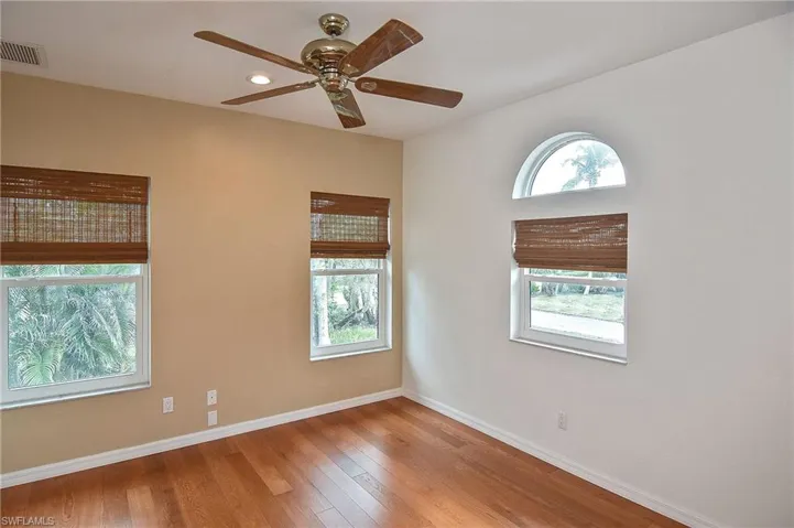 Spare room featuring light wood-type flooring and ceiling fan