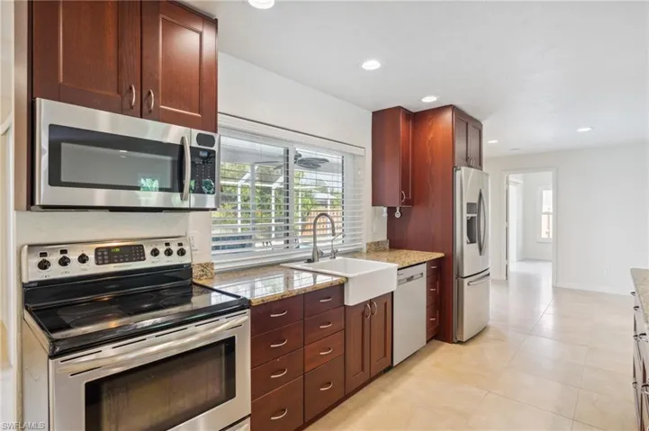 Enjoy looking out to the pool and backyard while washing the dishes and prepping dinner