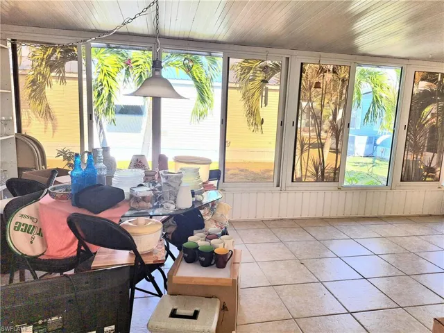 Sunroom / solarium with wooden ceiling