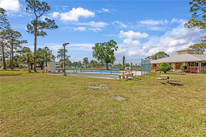 View of yard with tennis court