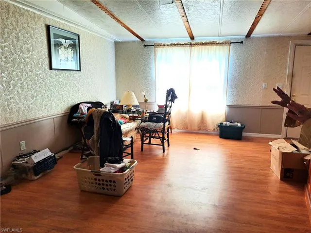 Large living area with beamed ceiling