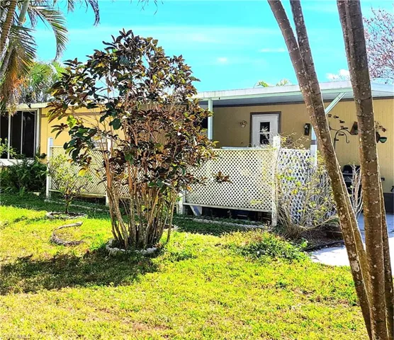 Back of property featuring a yard where a small fence could be added for your dog.