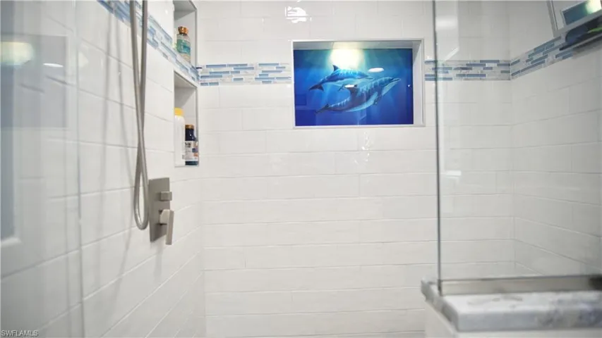 Bathroom featuring tiled shower