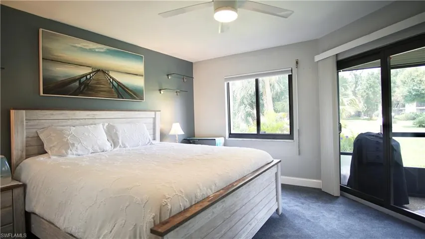 Bedroom featuring carpet and ceiling fan