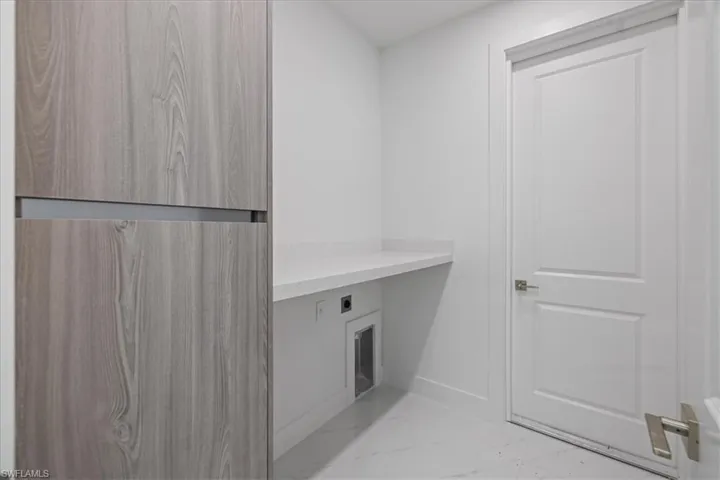 Clothes washing area with hookup for an electric dryer