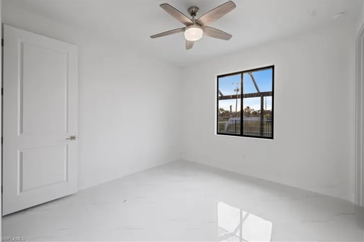 Empty room featuring ceiling fan