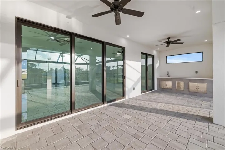 View of patio featuring ceiling fan