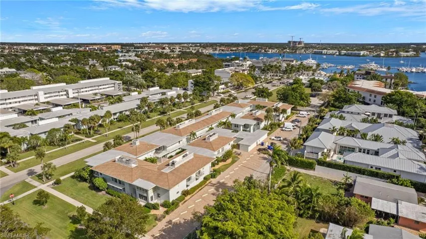 Aerial view of residential area featuring a large body of water