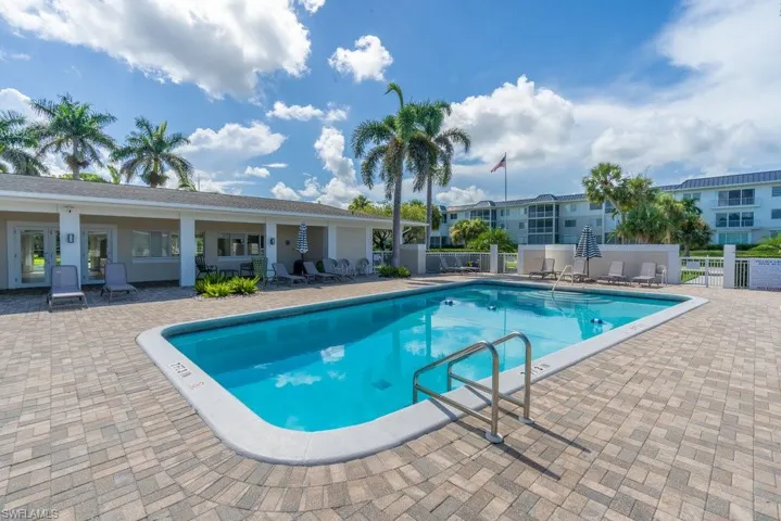 Community pool featuring a patio