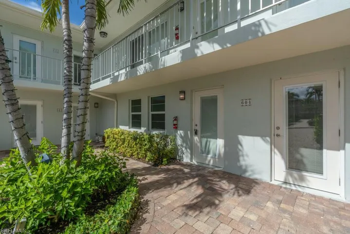 Entrance to property with stucco siding