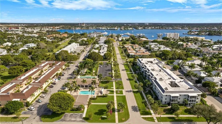 Aerial view of property's location featuring a large body of water