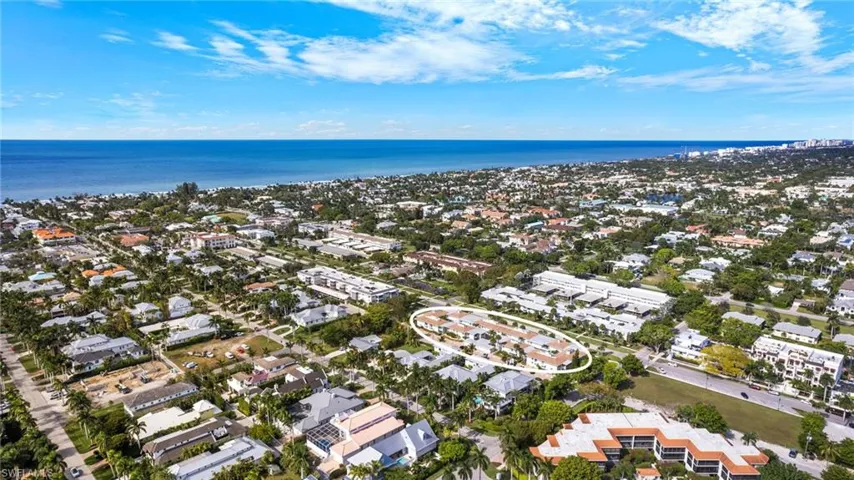 Aerial overview of property's location with a large body of water