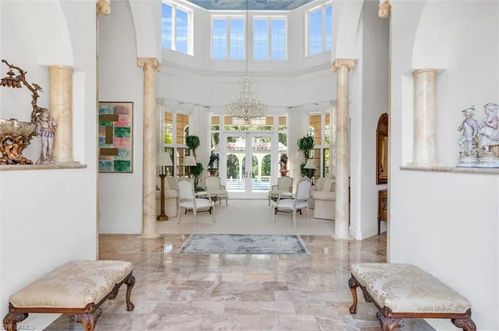 Grand Entry with Arched 26 foot Roofed Foyer with Marble Floor