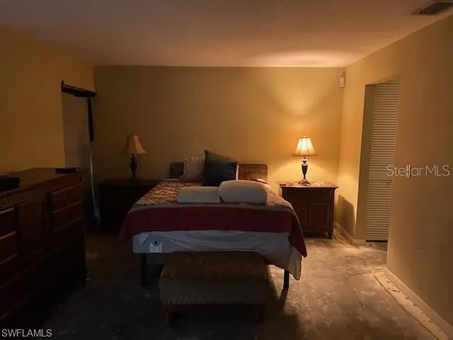 Primary Bedroom with a closet and bathroom