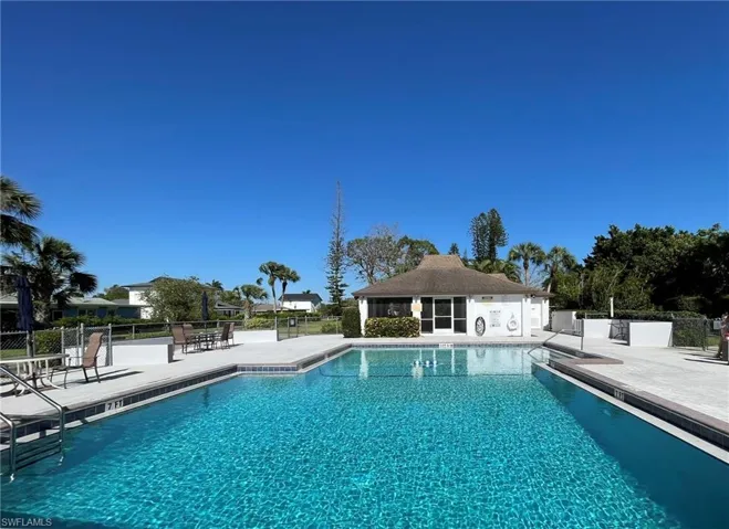 Community pool featuring a patio