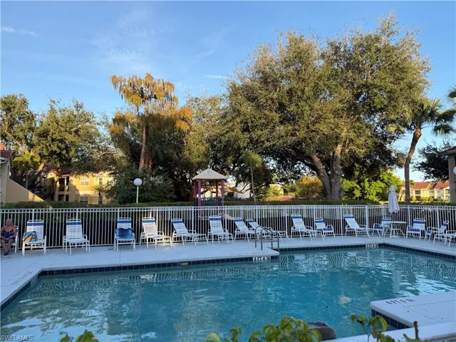 Community pool with a gazebo and a patio