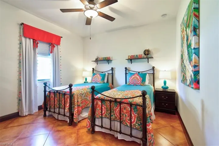 Tiled bedroom with ceiling fan