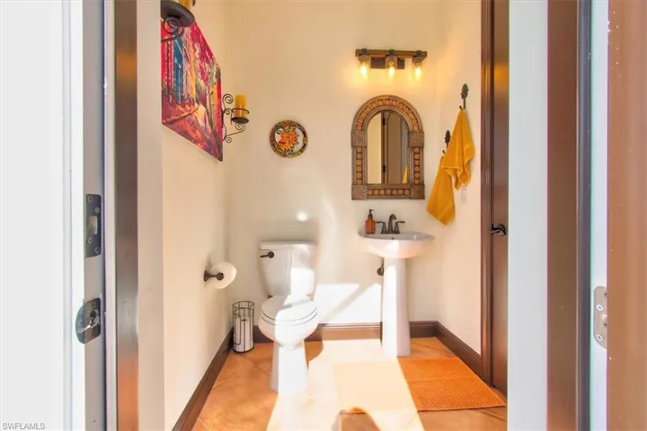 Bathroom featuring tile patterned floors and toilet