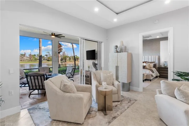 Living area with a ceiling fan and recessed lighting