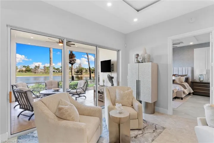 Living room featuring ceiling fan and recessed lighting