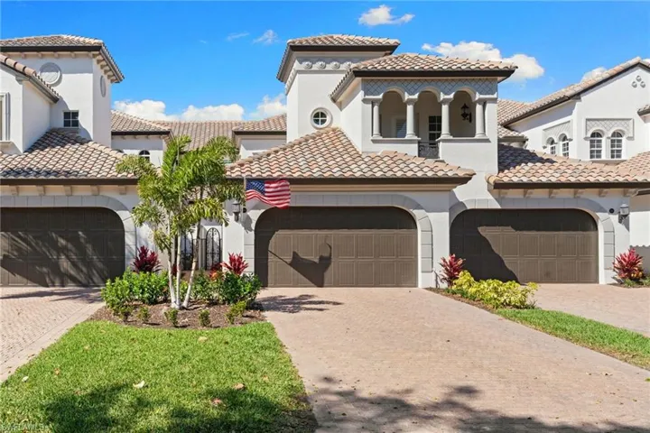 Mediterranean / spanish home featuring a tile roof, stucco siding, driveway, and a garage
