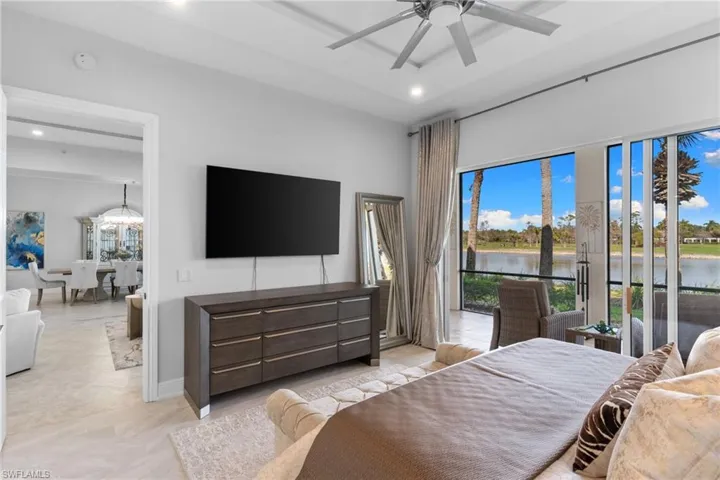 Bedroom with access to exterior, a ceiling fan, and recessed lighting