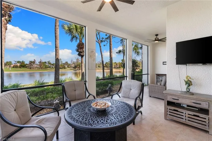 Sunroom featuring a ceiling fan and outdoor furniture