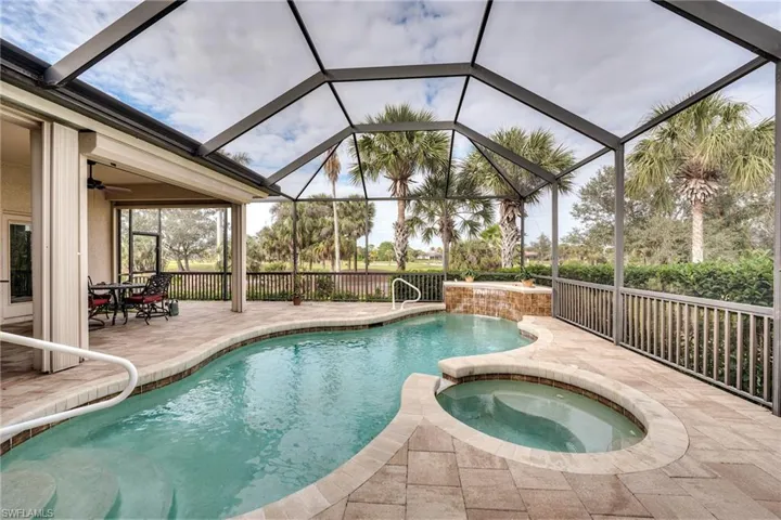 Heated pool and spa with a golf course view
