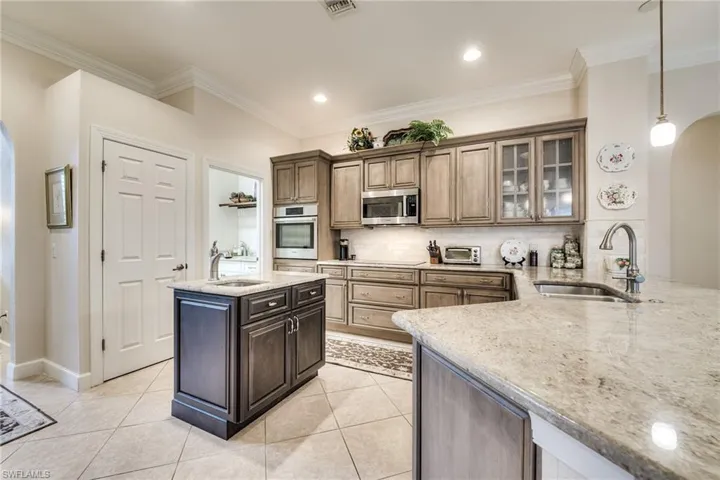 Bosch Induction Cooktop is under the microwave, and to the right of the wall mount oven