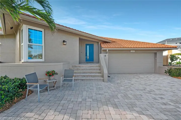 Pavered oversized driveway. home is completely guttered.