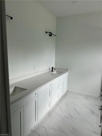 Bathroom featuring vanity and tile patterned flooring