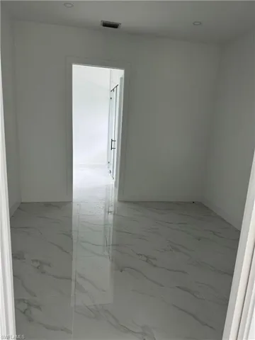 Unfurnished room with tile patterned flooring