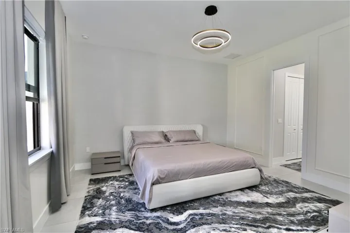 Bedroom featuring light tile patterned flooring