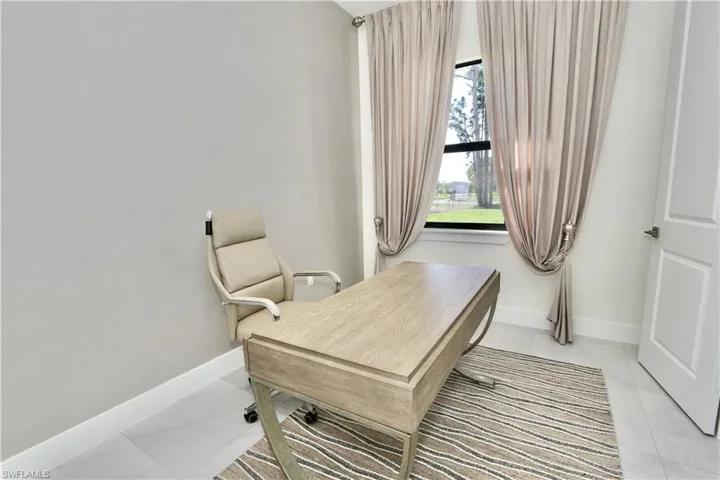 Office area featuring baseboards