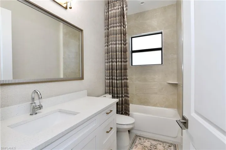 Full bathroom featuring vanity and shower / tub combo