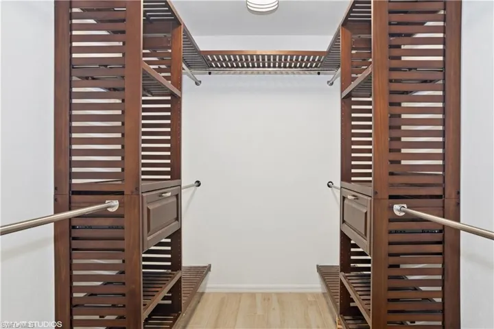 Spacious closet with wood finished floors