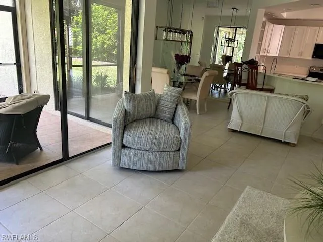 Living area featuring light tile patterned floors