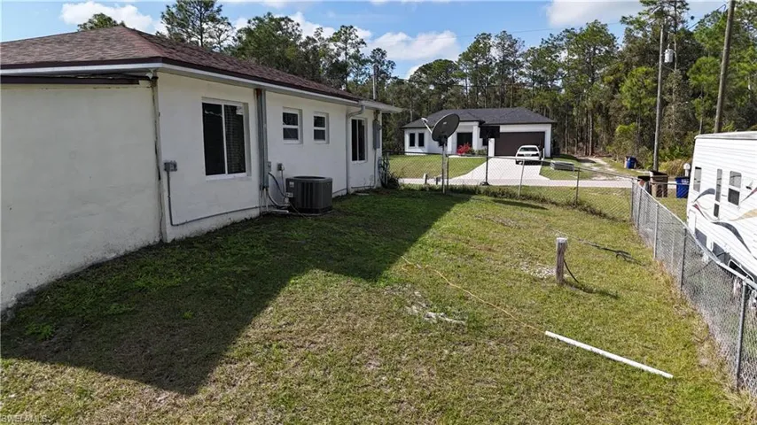 View of yard with central AC
