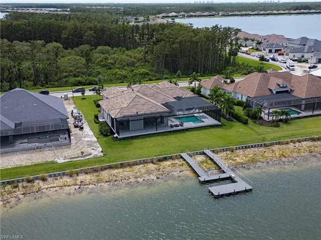 Bird's eye view featuring a water view and a residential view