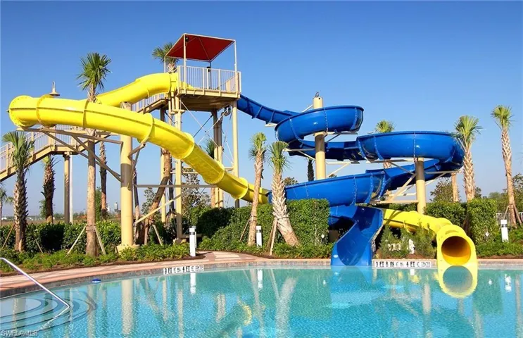 Community pool featuring a water slide