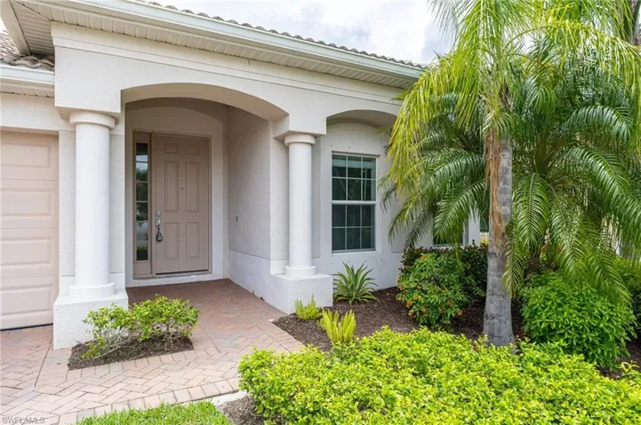 Entrance to property featuring stucco siding